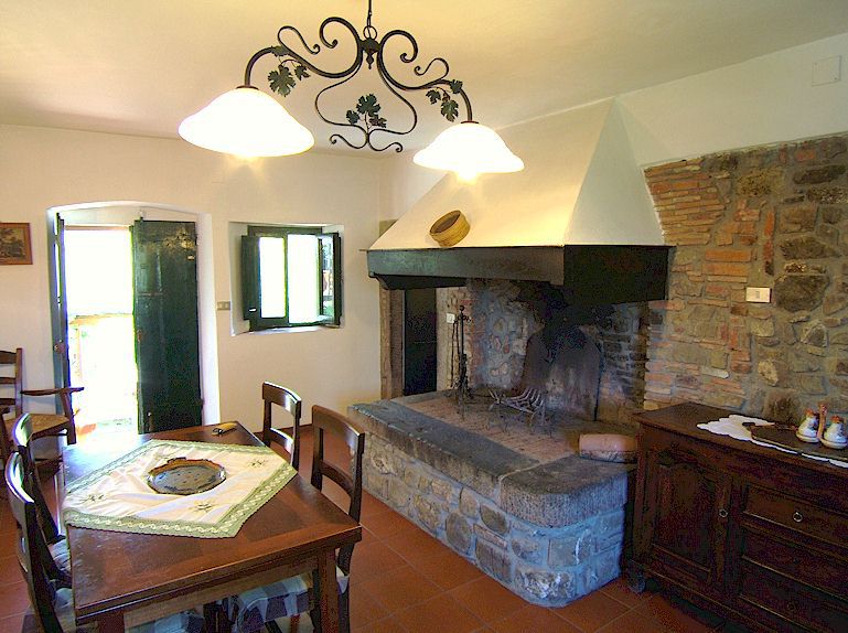 Apartment Alessandra — cozy living space with fireplace